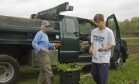 Ben drops off barrel of Garlic MustardMustard at Jane's truck.