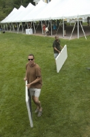 Portaging tables from tent to truck