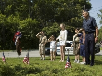 Boy and Girl scouts salute wreath