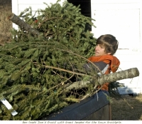 Ben loads unsold tree on Don\'s truck